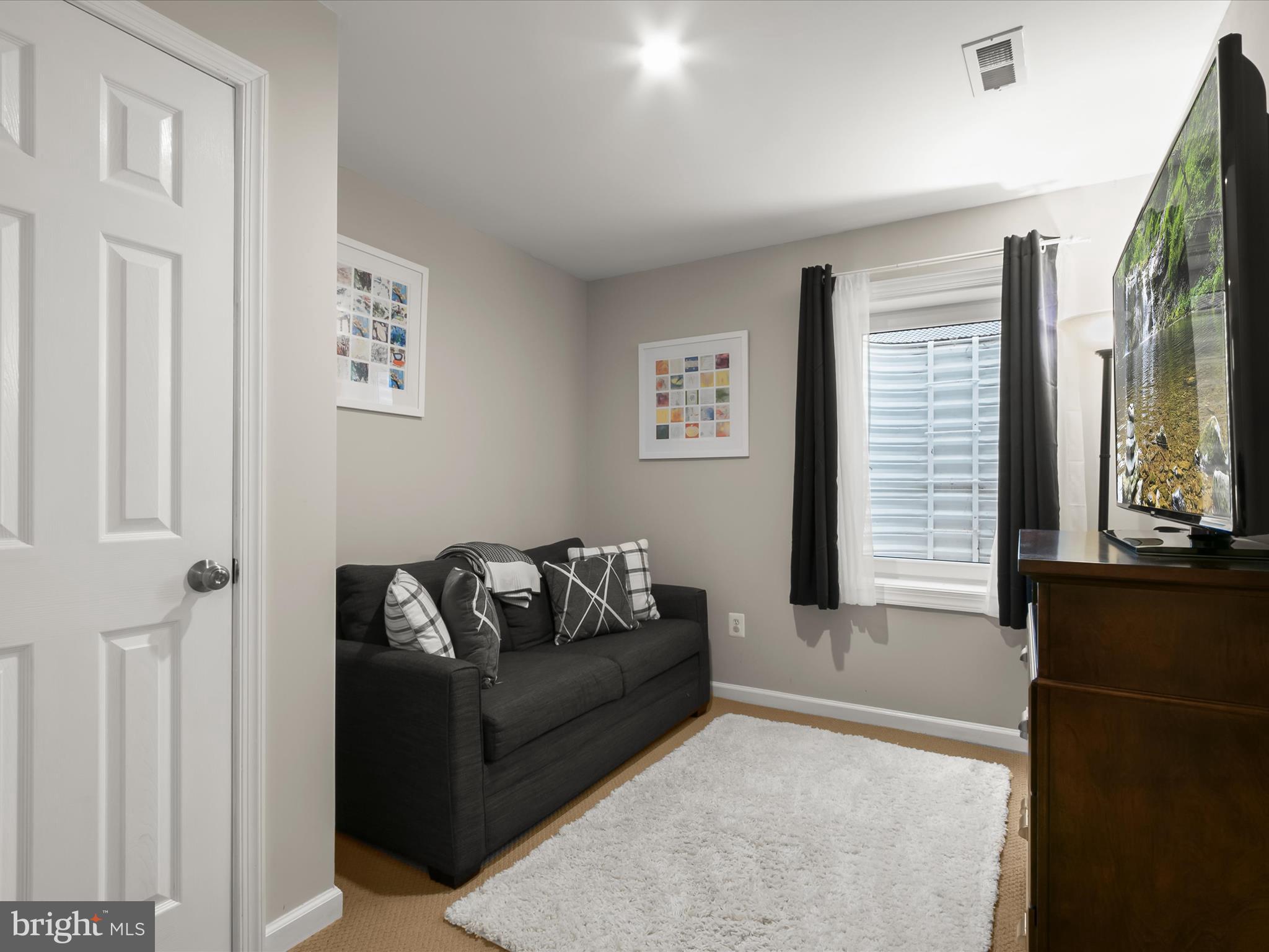 9808 Darcy Forest Drive Silver Spring, MD 20910 - Photo 53 of 82 a living room with furniture and a window