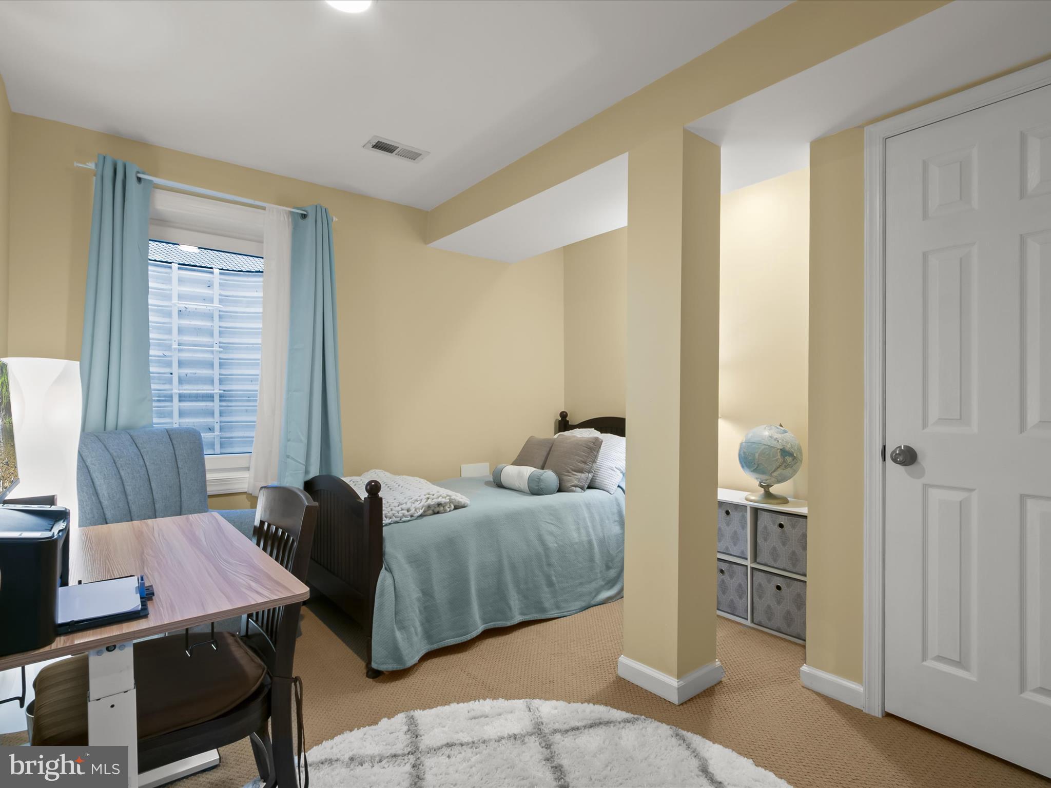 9808 Darcy Forest Drive Silver Spring, MD 20910 - Photo 57 of 82 a bedroom with a bed and wooden floor