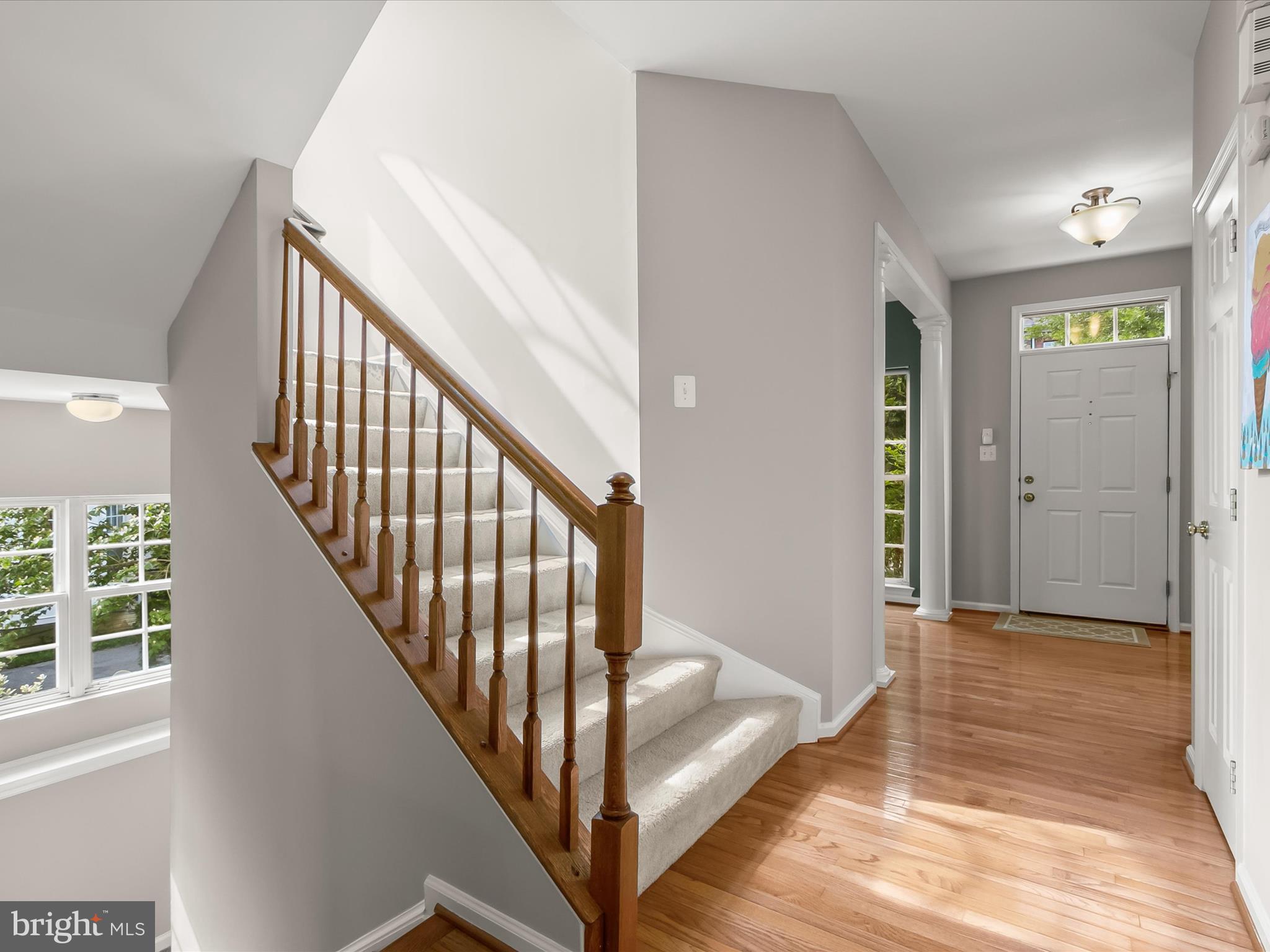 9808 Darcy Forest Drive Silver Spring, MD 20910 - Photo 6 of 82 a view of a hallway with wooden floor and staircase
