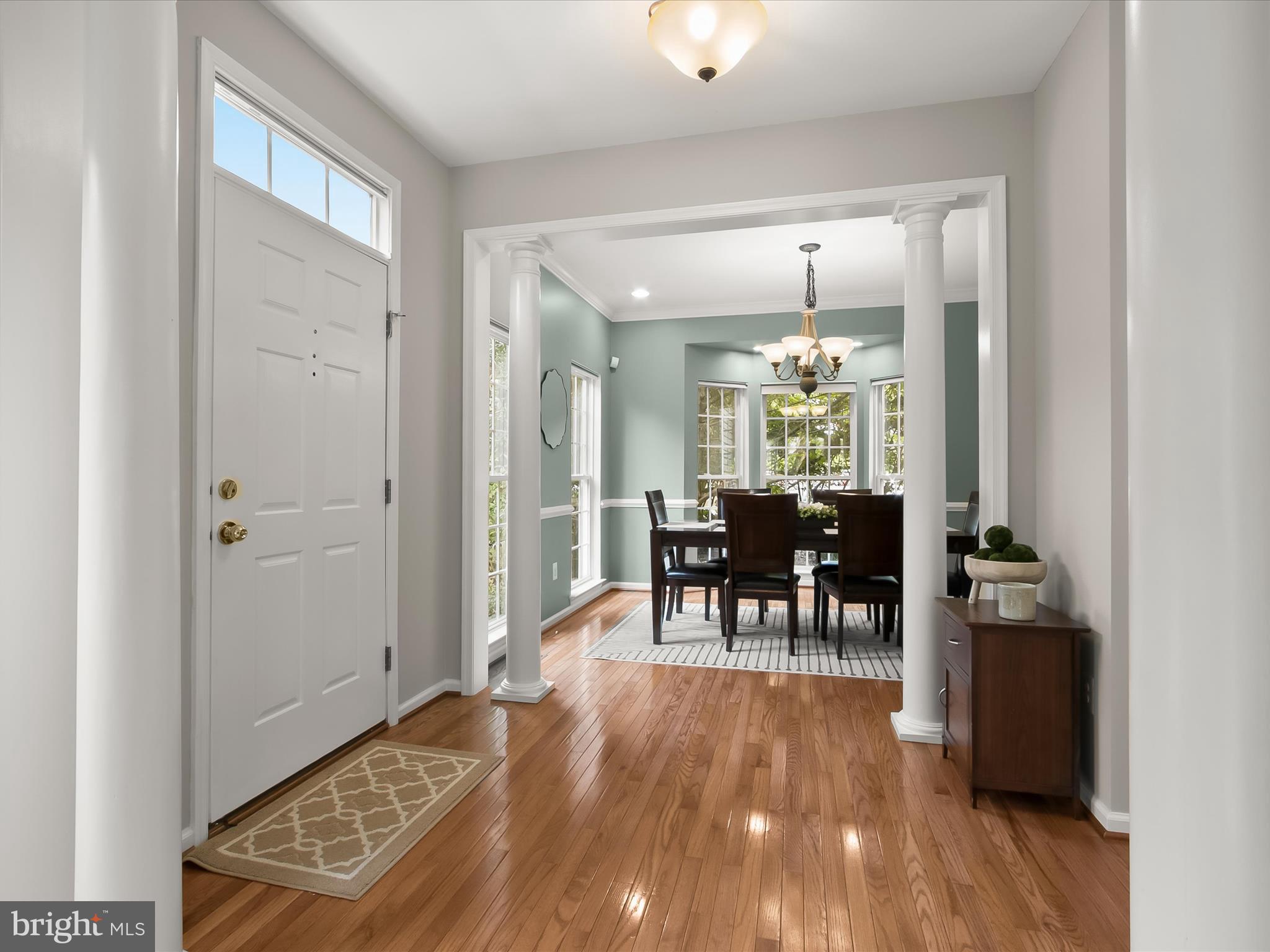 9808 Darcy Forest Drive Silver Spring, MD 20910 - Photo 7 of 82 a view of a dining room with furniture and chandelier