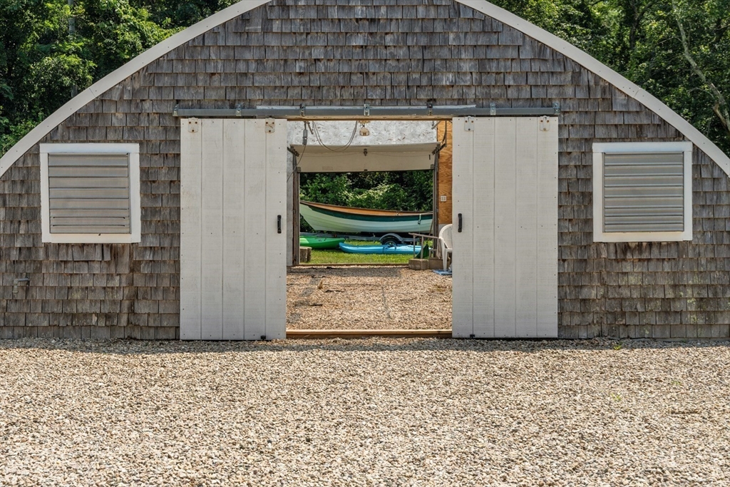 1251 County Road Bourne, MA 02534 - Photo 19 of 42 a front view of a house with a yard
