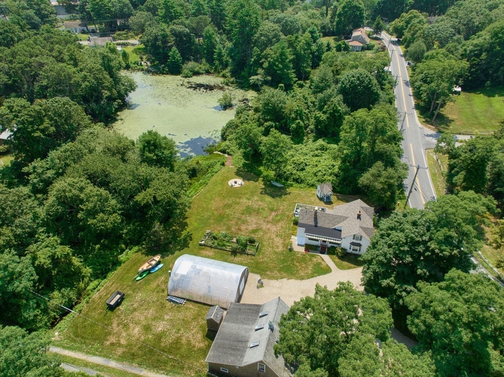 1251 County Road Bourne, MA 02534 - Photo 36 of 42 an aerial view of a house with swimming pool and garden view
