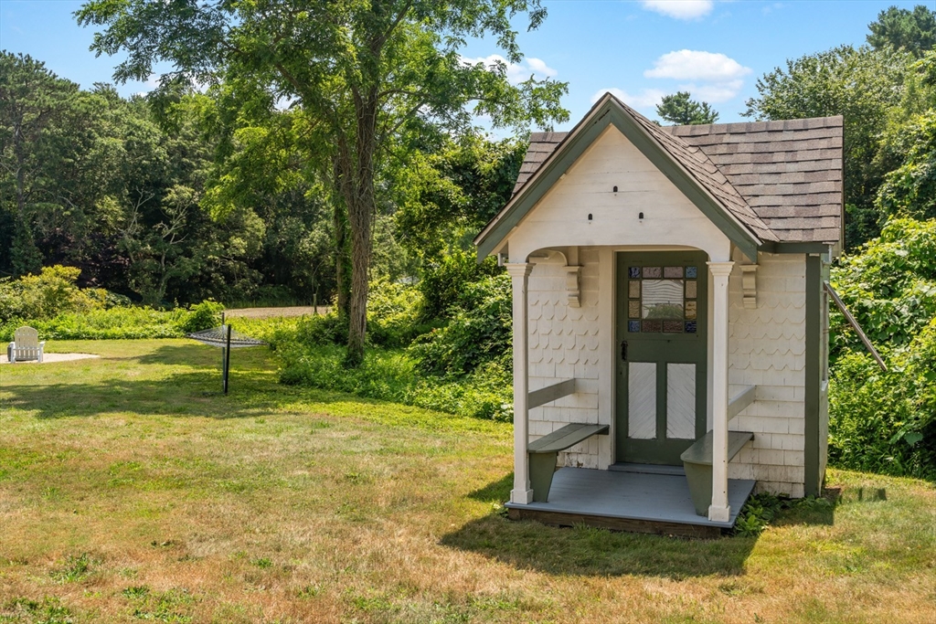 1251 County Road Bourne, MA 02534 - Photo 41 of 42 a view of a house with backyard and trees