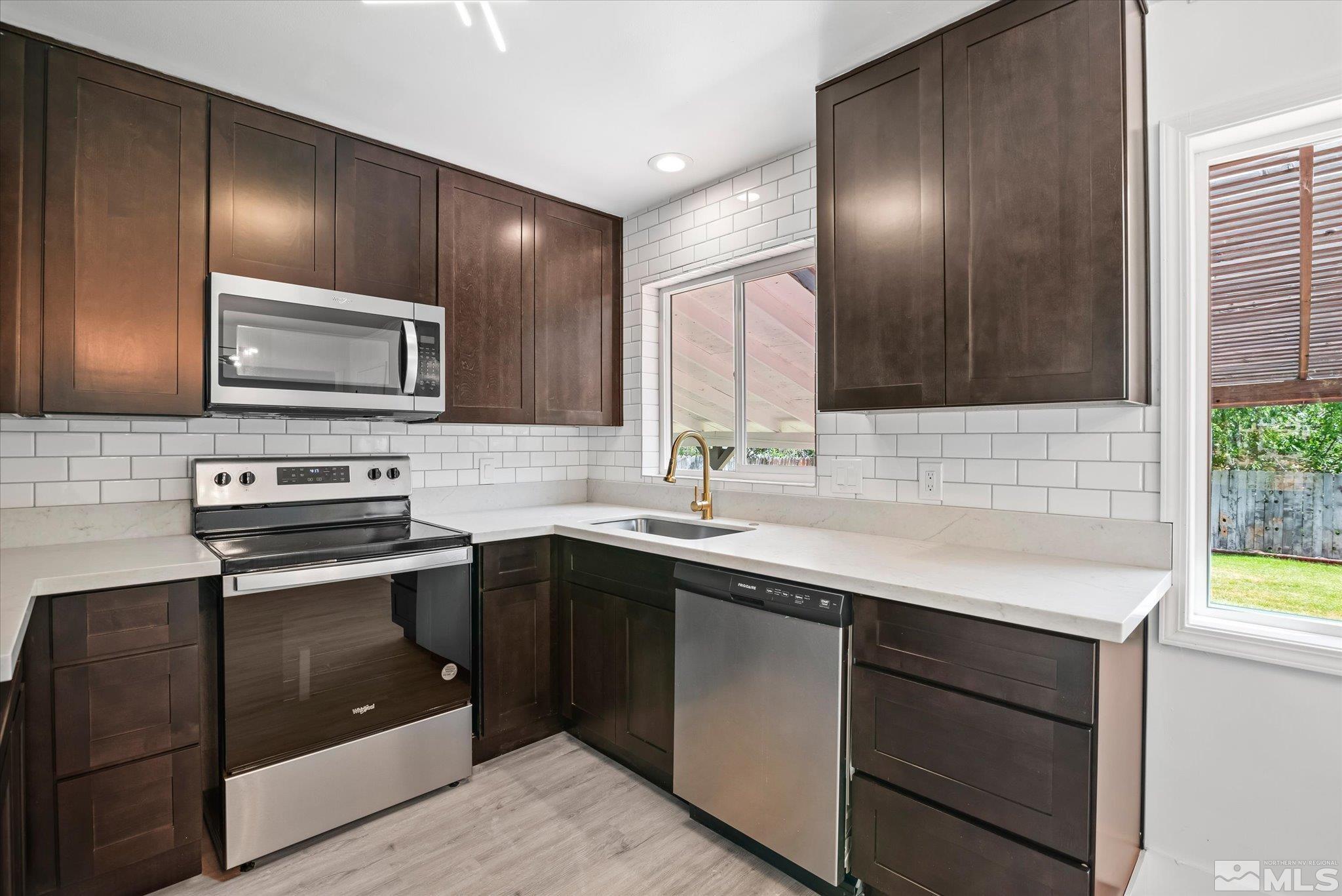 1760 Grandview Avenue Reno, NV 89503 - Photo 15 of 35 a kitchen with stainless steel appliances granite countertop wooden cabinets and a sink