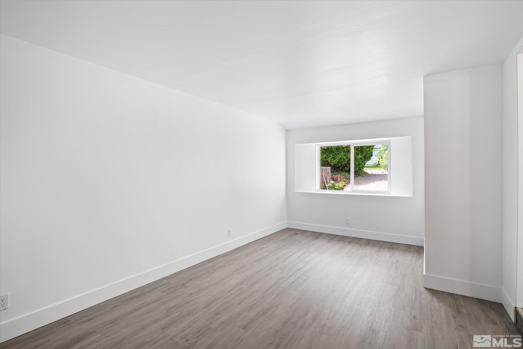 1760 Grandview Avenue Reno, NV 89503 - Photo 21 of 35 an empty room with wooden floor and windows