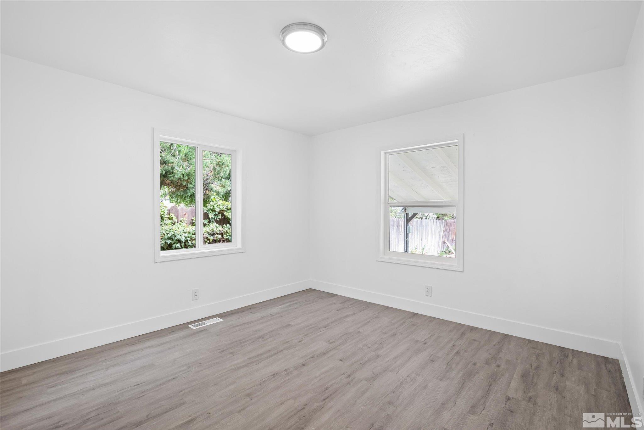 1760 Grandview Avenue Reno, NV 89503 - Photo 25 of 35 an empty room with wooden floor and windows