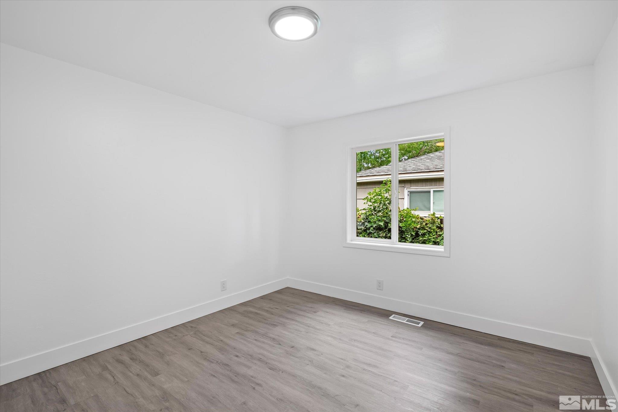 1760 Grandview Avenue Reno, NV 89503 - Photo 27 of 35 an empty room with wooden floor and window