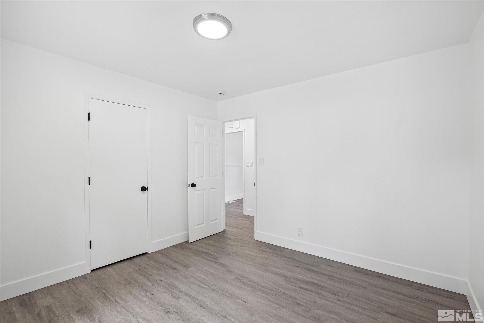 1760 Grandview Avenue Reno, NV 89503 - Photo 28 of 35 a view of an empty room with wooden floor