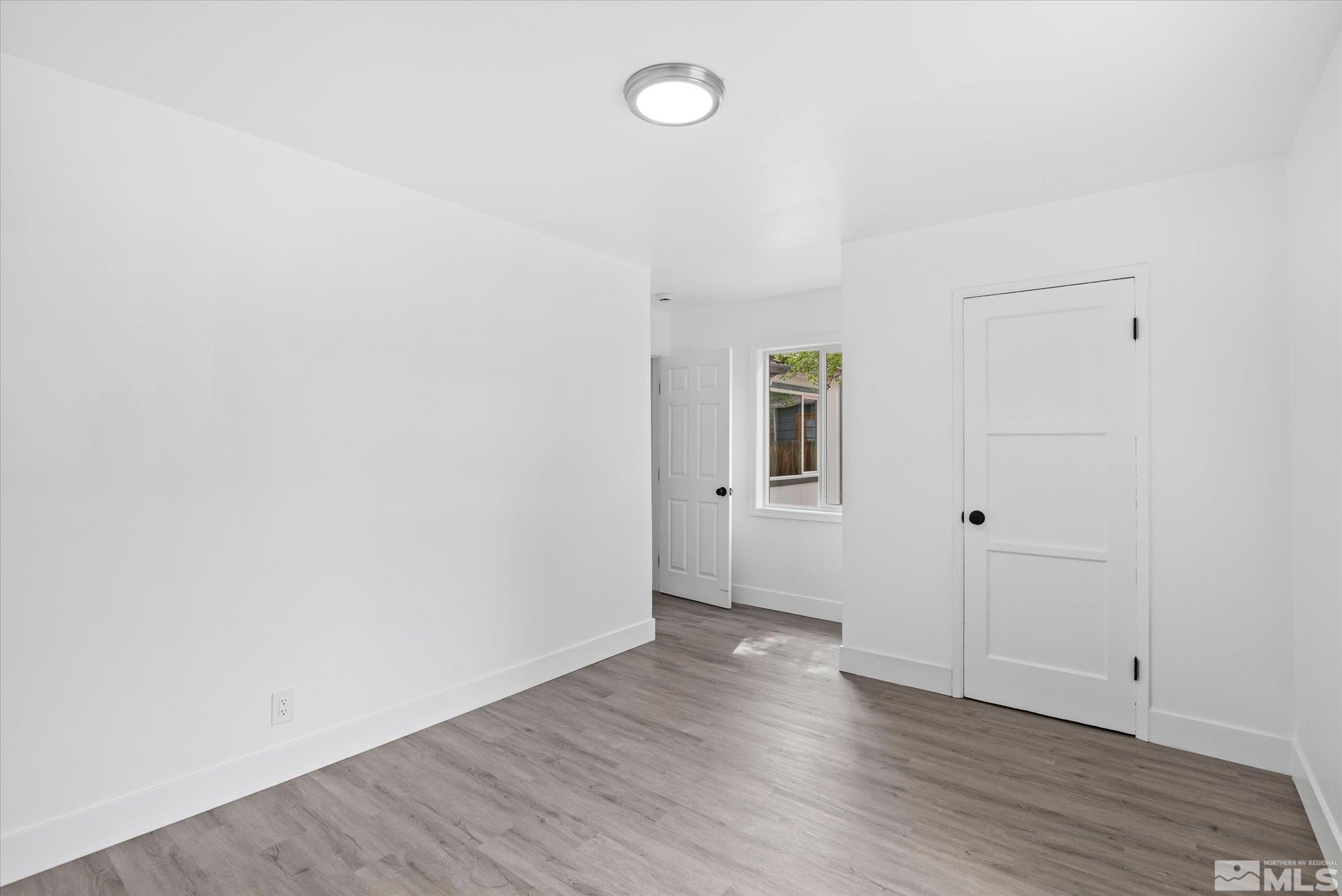 1760 Grandview Avenue Reno, NV 89503 - Photo 30 of 35 a view of an empty room with wooden floor and a window