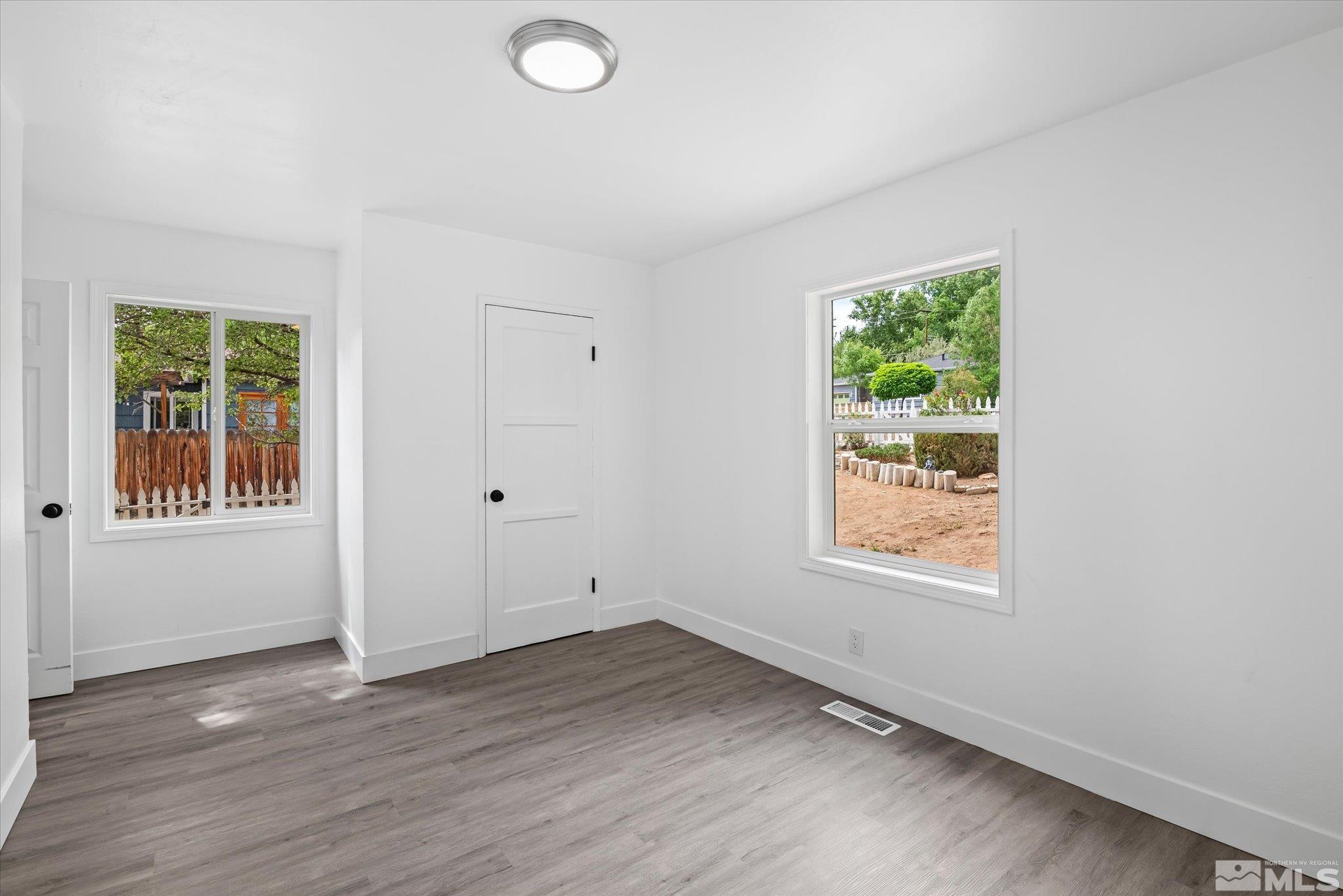 1760 Grandview Avenue Reno, NV 89503 - Photo 31 of 35 an empty room with wooden floor and windows