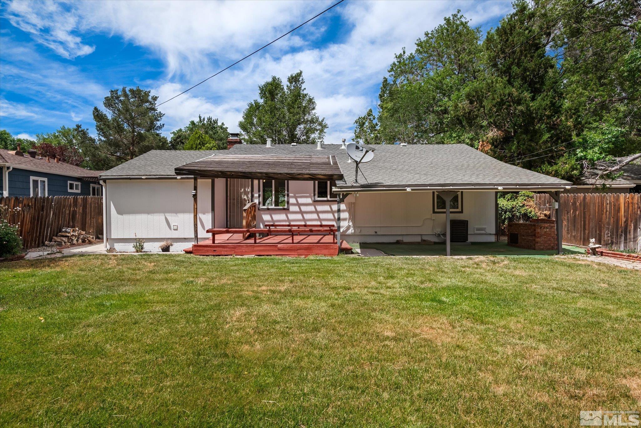 1760 Grandview Avenue Reno, NV 89503 - Photo 32 of 35 a front view of a house with a yard and trees