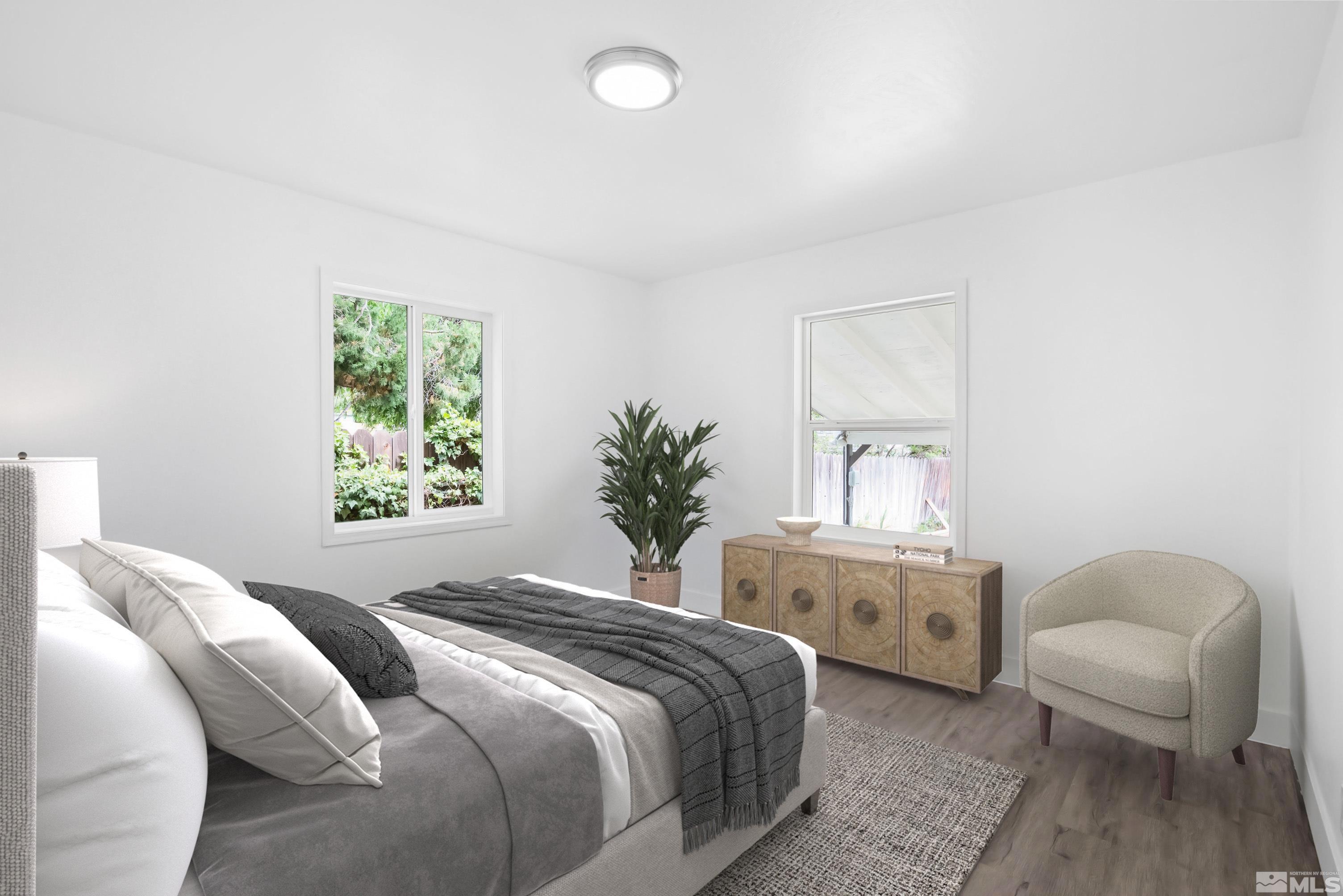 1760 Grandview Avenue Reno, NV 89503 - Photo 6 of 35 a bedroom with a large bed and a couch