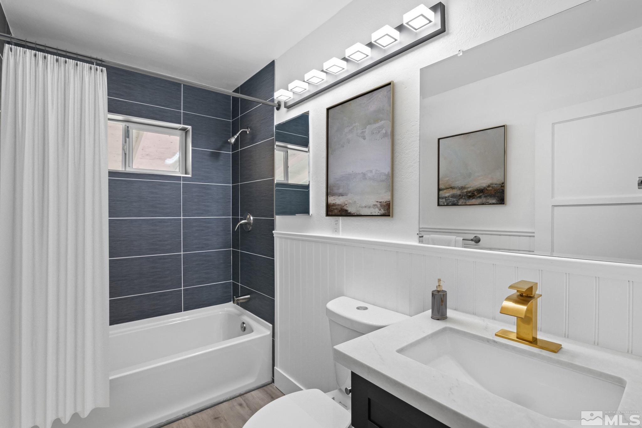 1760 Grandview Avenue Reno, NV 89503 - Photo 8 of 35 a bathroom with a sink a toilet and shower