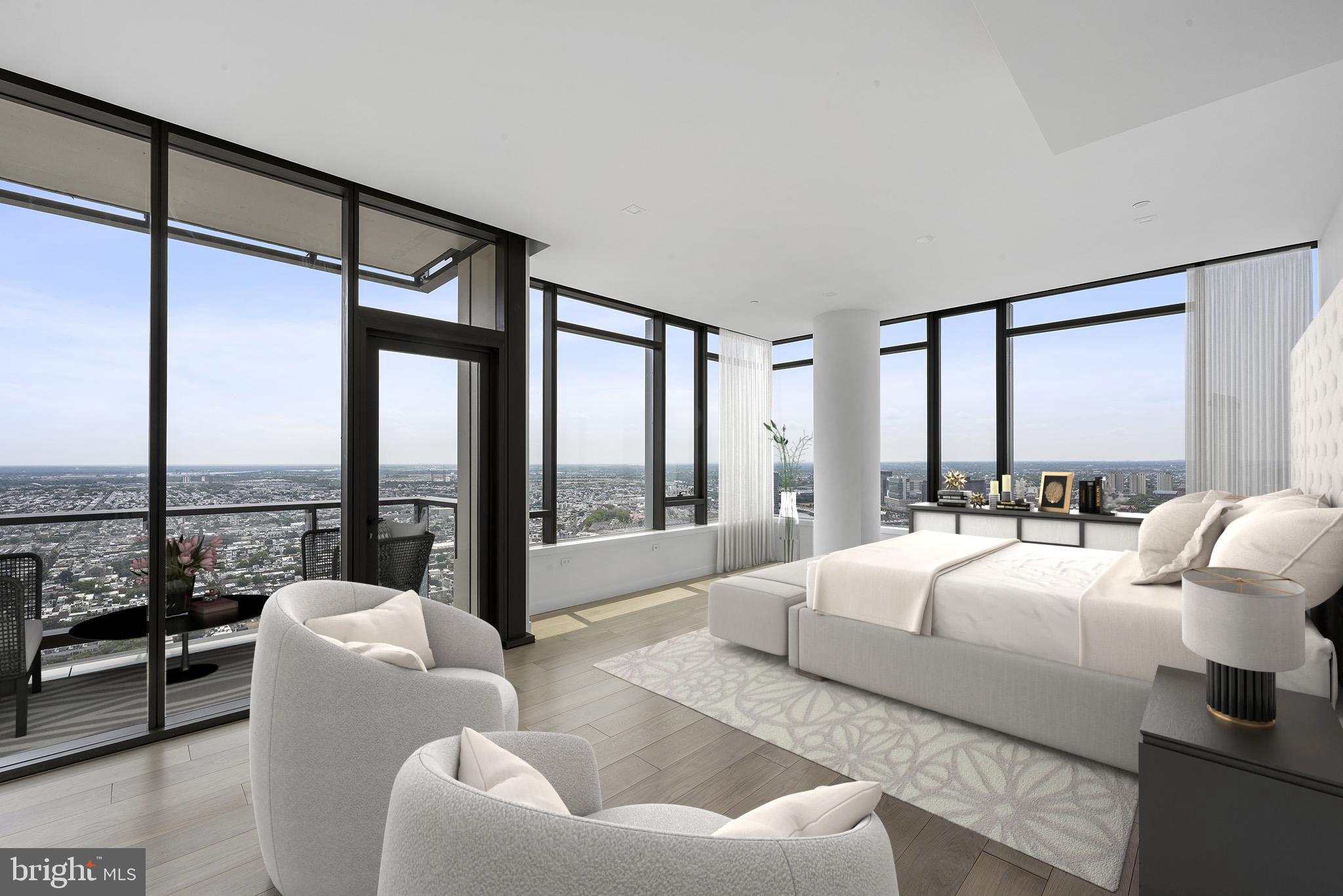 1911 Walnut Street, Unit 4401 Philadelphia, PA 19103 - Photo 4 of 18 a bedroom with furniture and large windows