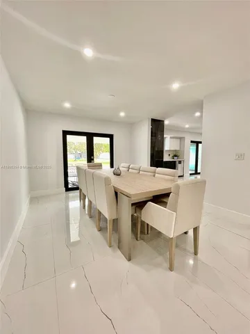 a large room with lots of chairs and a projector screen