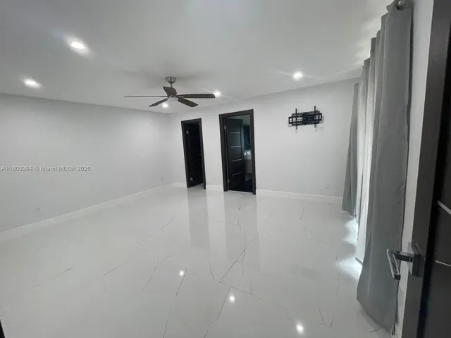 a bathroom with a glass shower door