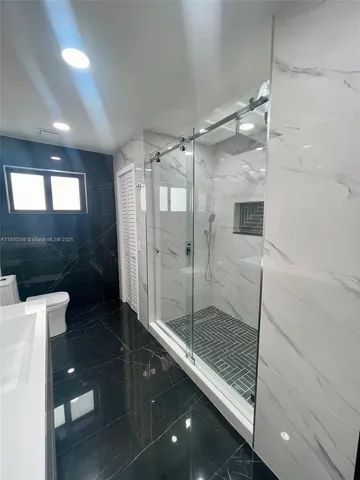 a bathroom with a double vanity sink and mirror