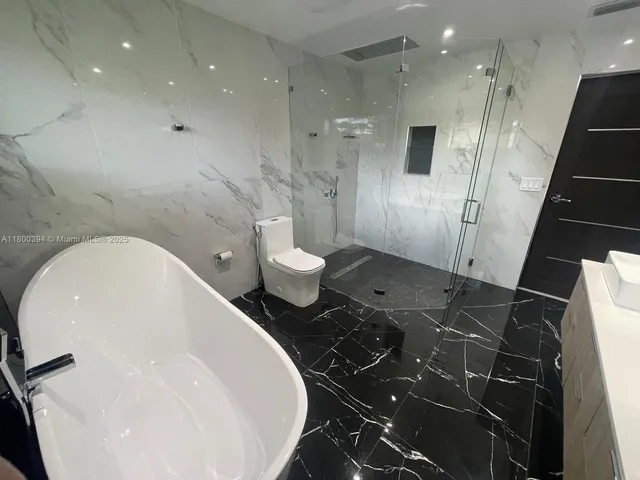 a view of a backyard with sitting area