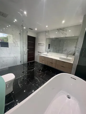 a view of a park with large trees