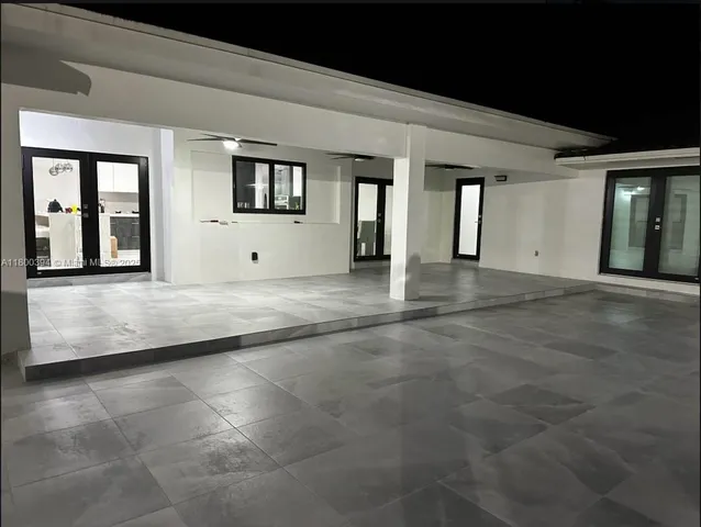 an aerial view of multiple houses with yard