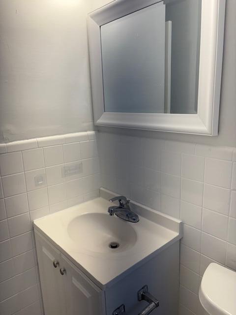 958 West 3rd Street Riviera Beach, FL 33404 - Photo 9 of 10 a bathroom with a sink and mirror