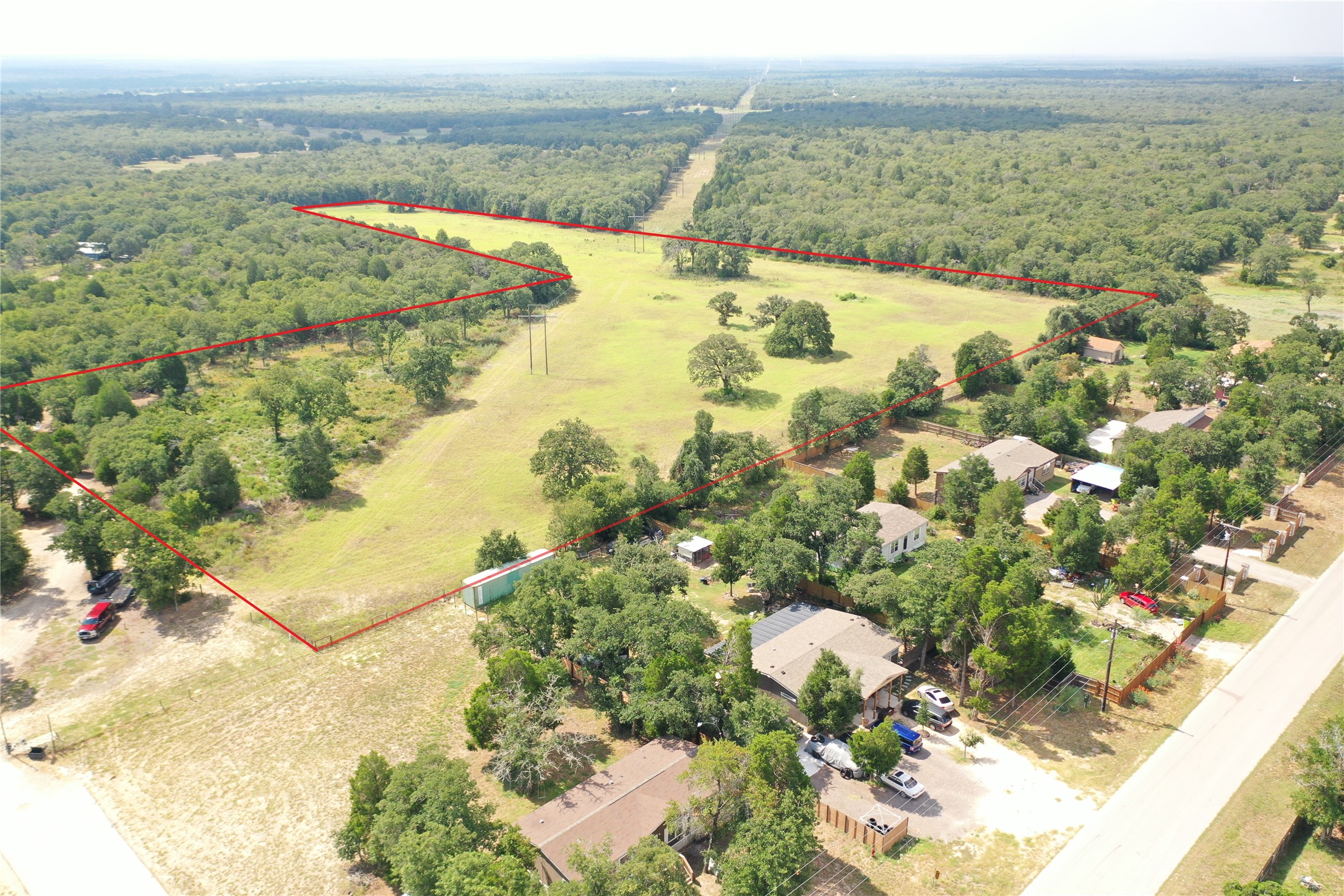 446 Las Lomas Drive Elgin, TX 78621 - Photo 3 of 9 Overview of rural landscape featuring property parcel outlined