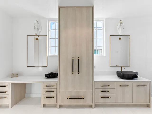 a bathroom with a sink a mirror and shower