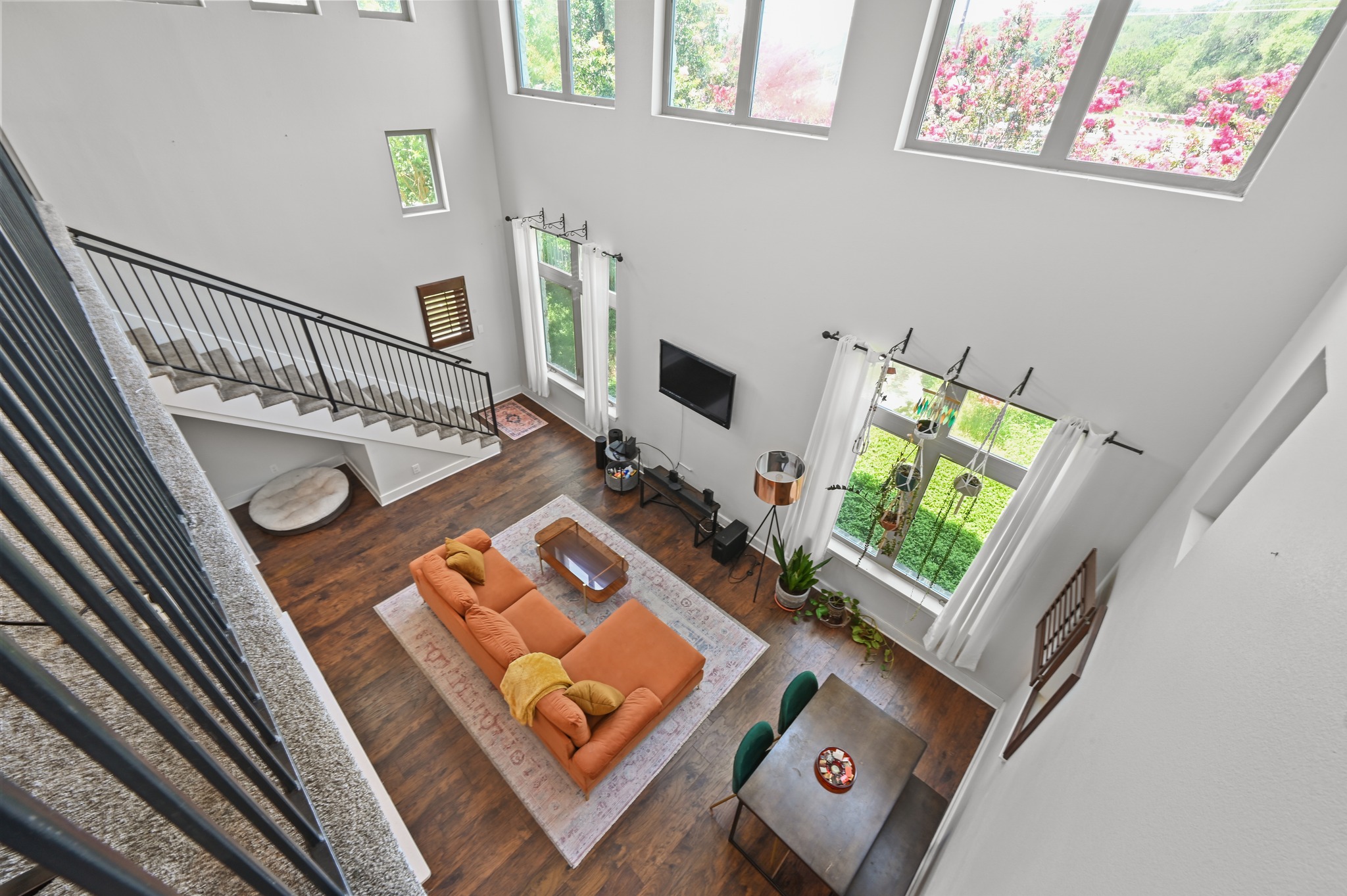 592 Farm To Market 967, Unit B Buda, TX 78610 - Photo 19 of 26 From above, the home's impressive two-story design comes to life, showcasing soaring ceilings and an open-concept layout that creates a bright, spacious feel throughout.