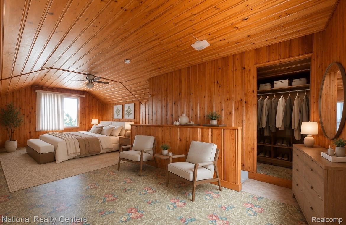 7285 Helen Street Center Line, MI 48015 - Photo 20 of 32 Wood-paneled room featuring an open closet with built-in shelving, a ceiling fan, and sloped ceilings