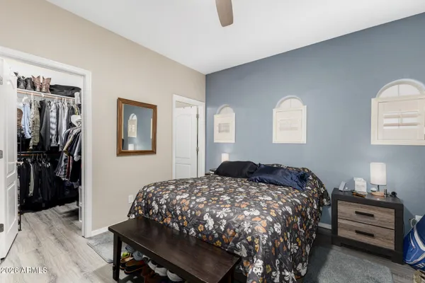 a bedroom with a bed and a lamp