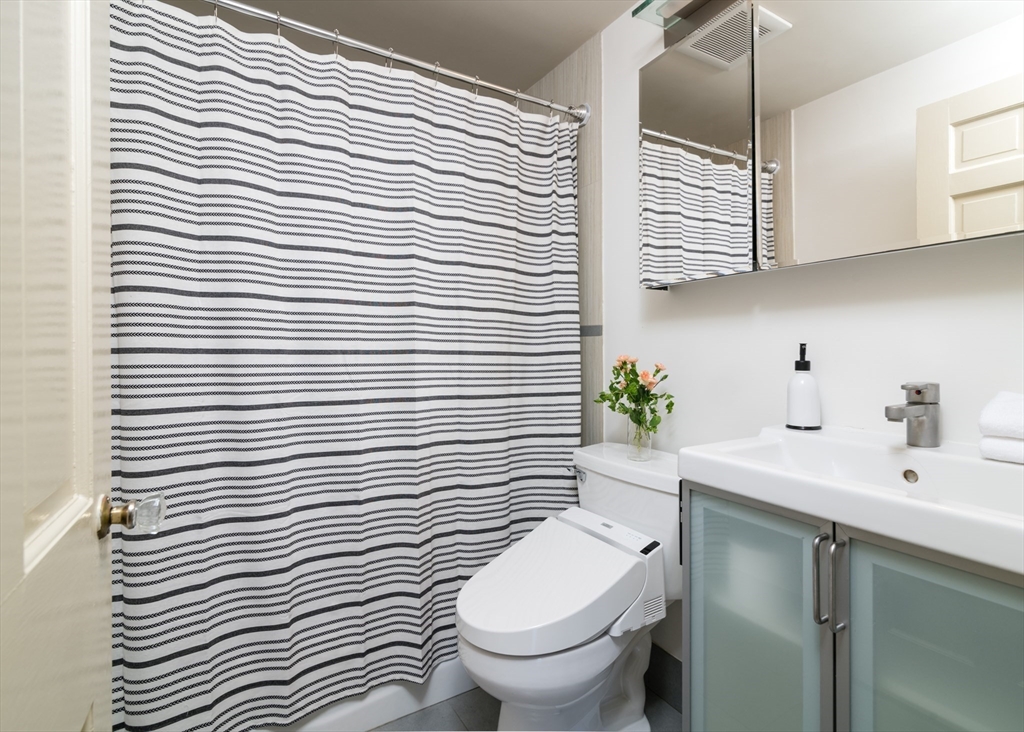 18 Kenilworth Road Arlington, MA 02476 - Photo 12 of 26 a white toilet sitting next to a white sink