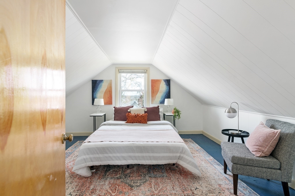 18 Kenilworth Road Arlington, MA 02476 - Photo 14 of 26 a bedroom with a bed and window