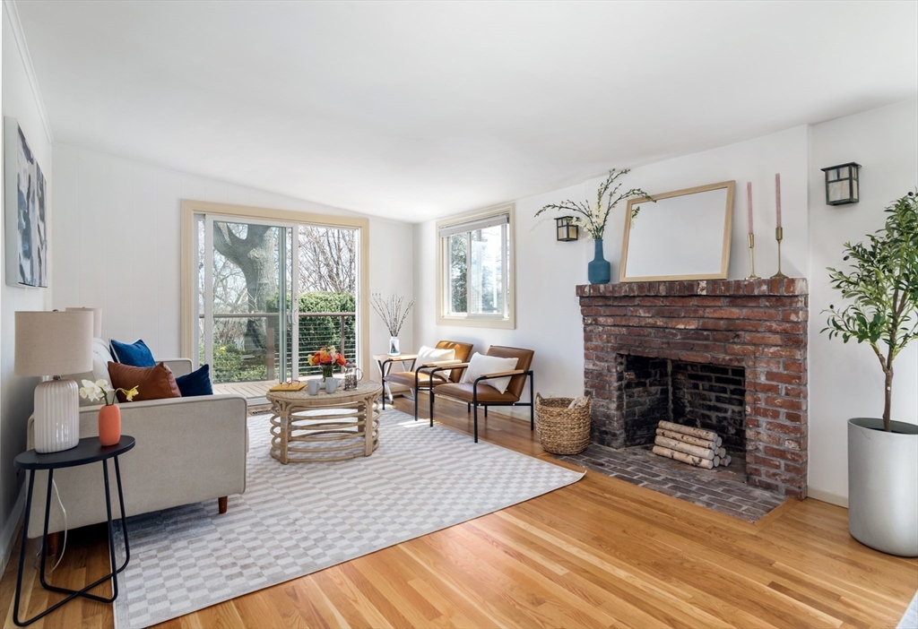18 Kenilworth Road Arlington, MA 02476 - Photo 9 of 26 a living room with furniture and a fireplace