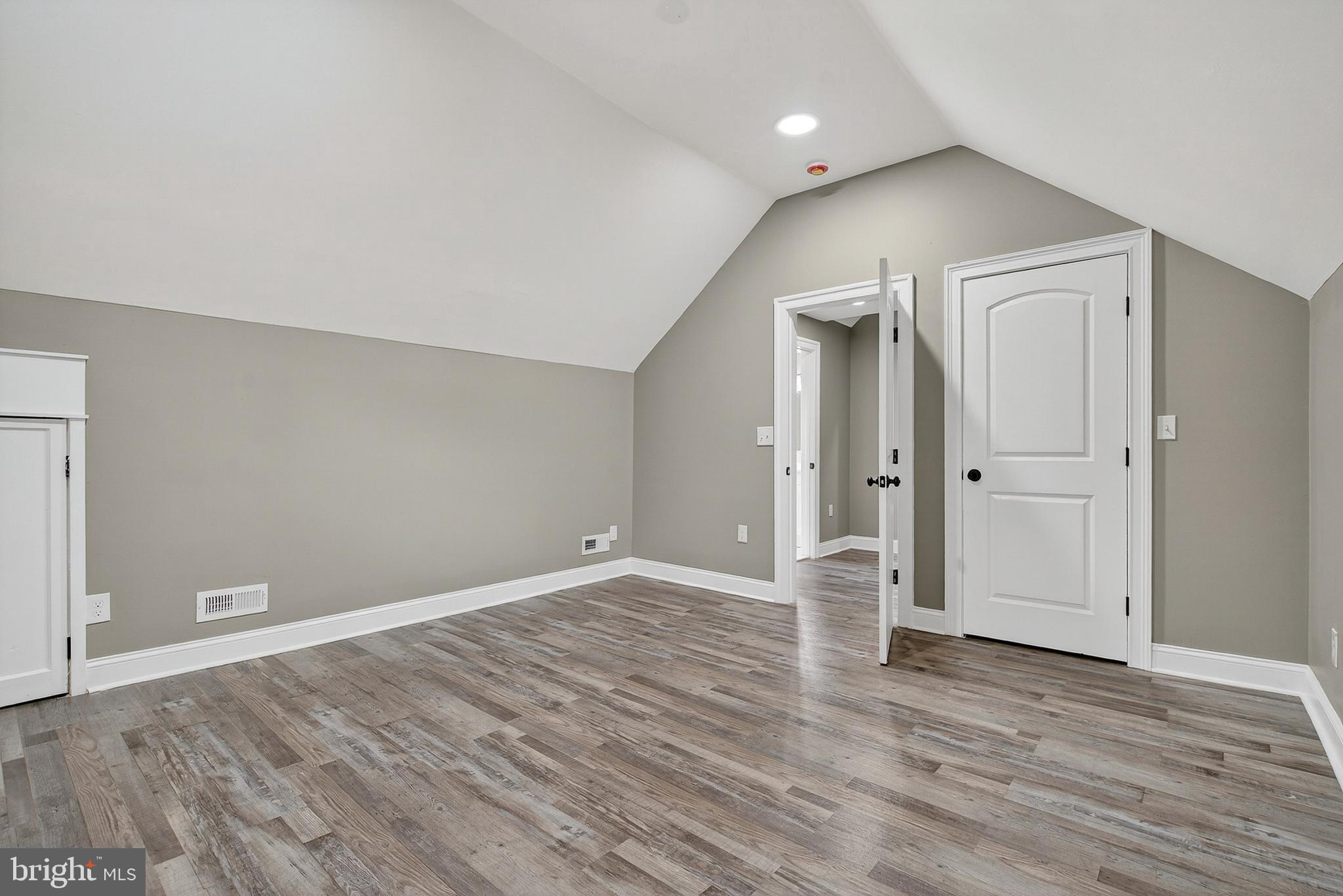 3310 Glen Avenue Baltimore, MD 21215 - Photo 22 of 33 wooden floor in an empty room with a window
