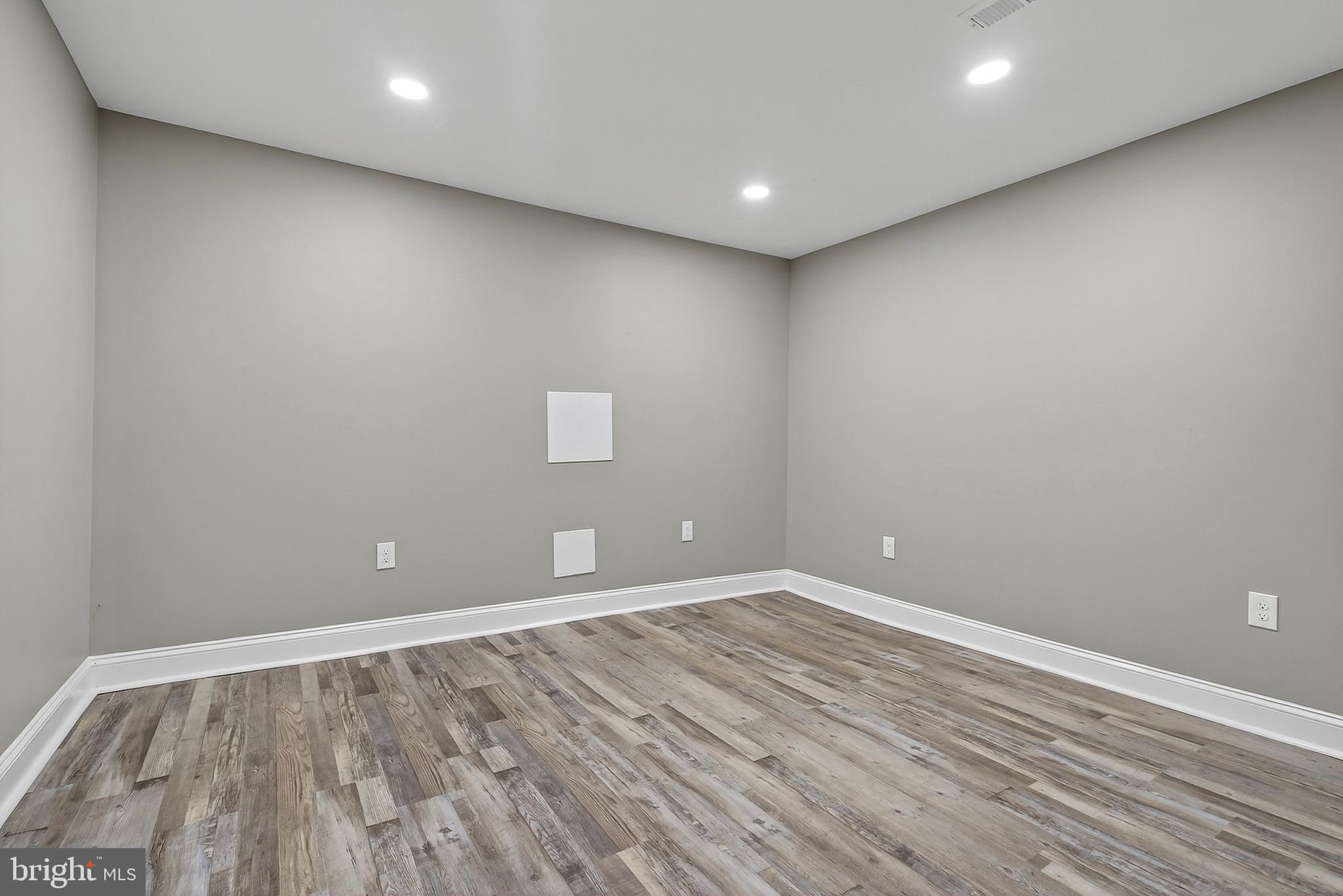 3310 Glen Avenue Baltimore, MD 21215 - Photo 23 of 33 a view of room with wooden floor and window