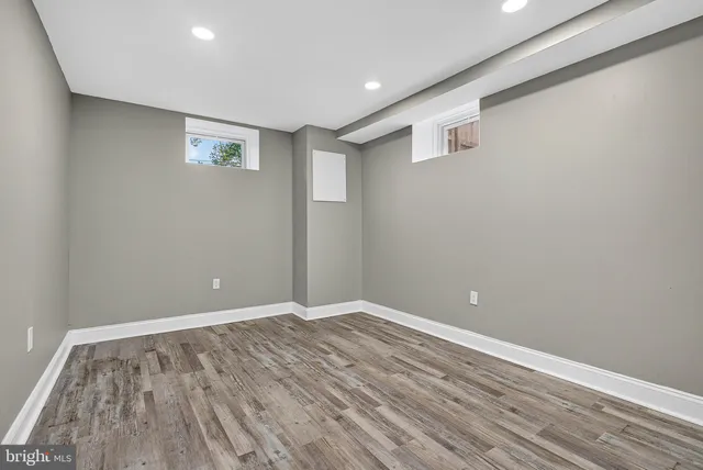 a view of room with wooden floor