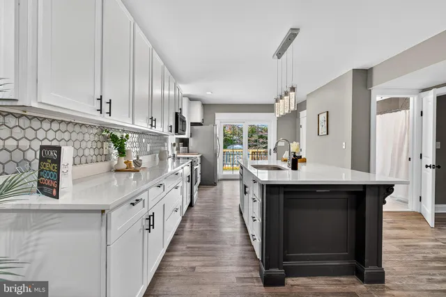 a kitchen with stainless steel appliances lots of counter top space and cabinets