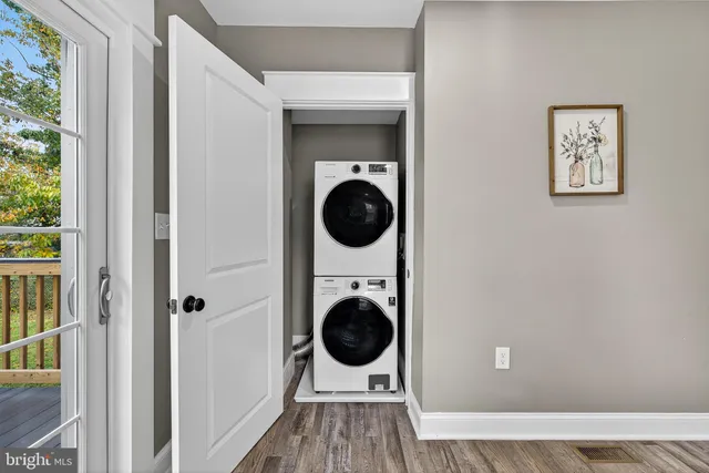 a view of a hallway with washer and dryer