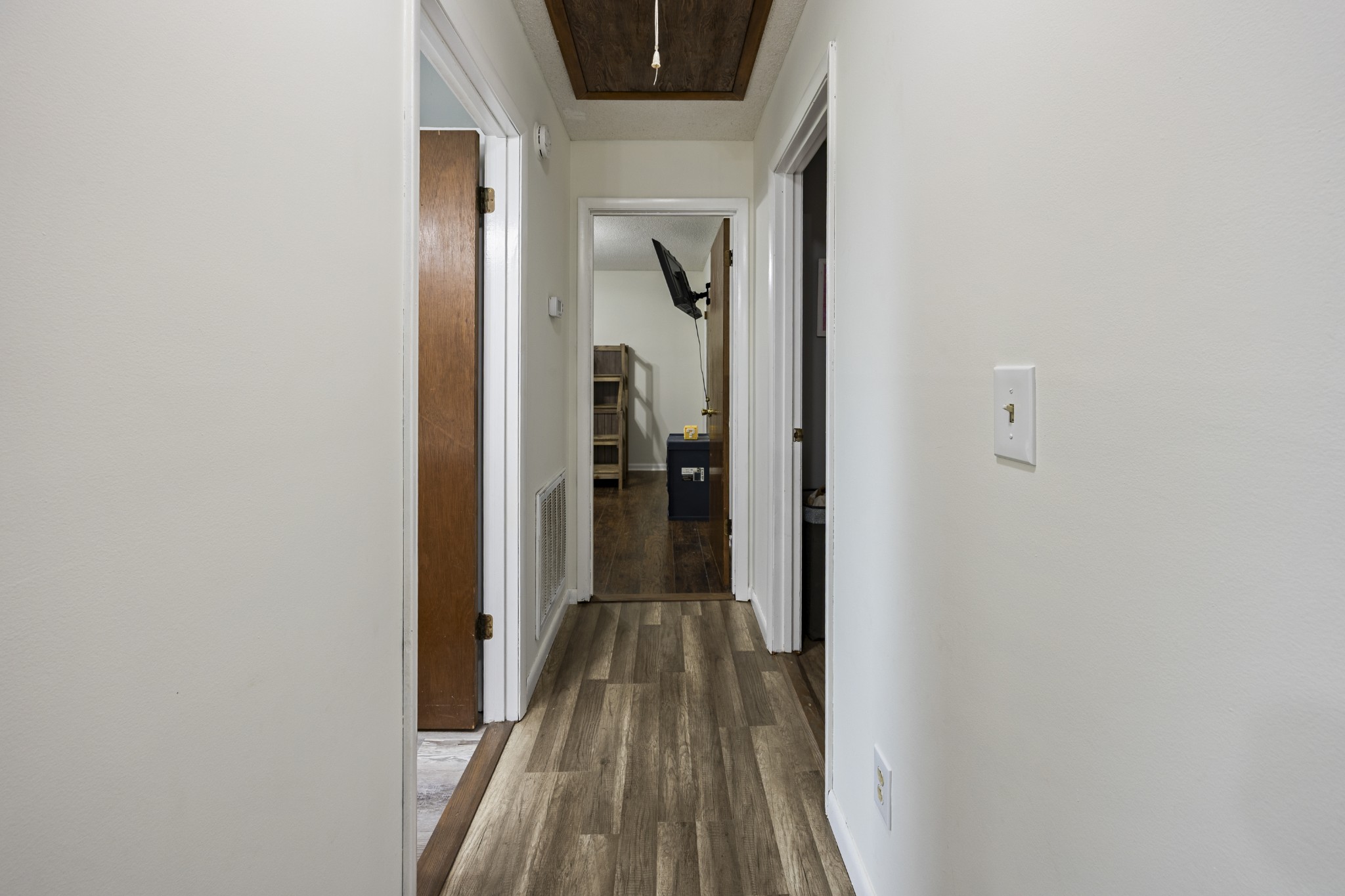 421 Shady Grove Road Flintville, TN 37335 - Photo 14 of 33 a view of a hallway with wooden floor and a bathroom