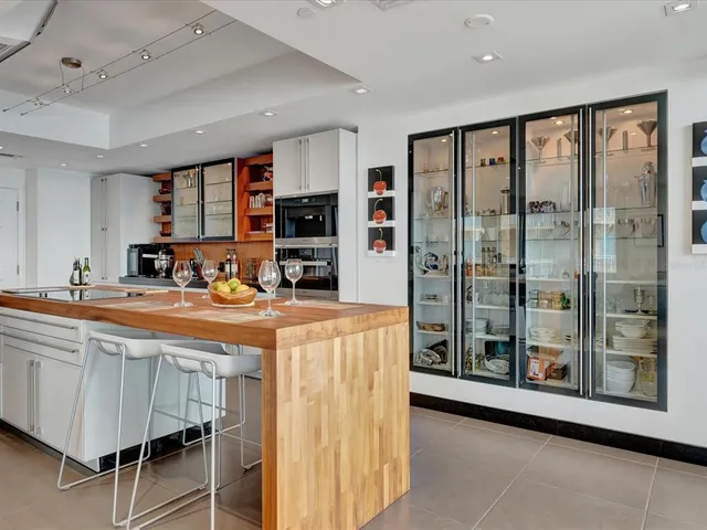 a kitchen with stainless steel appliances granite countertop a stove and a refrigerator