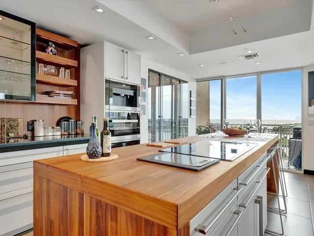 a kitchen with a stove a sink and a refrigerator