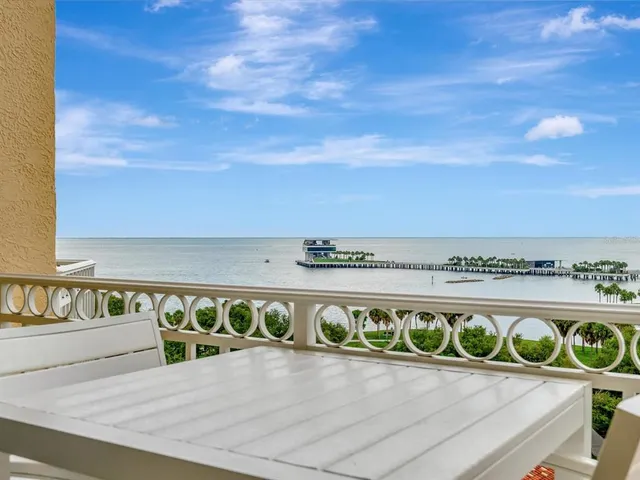 a view of a swimming pool with an outdoor seating