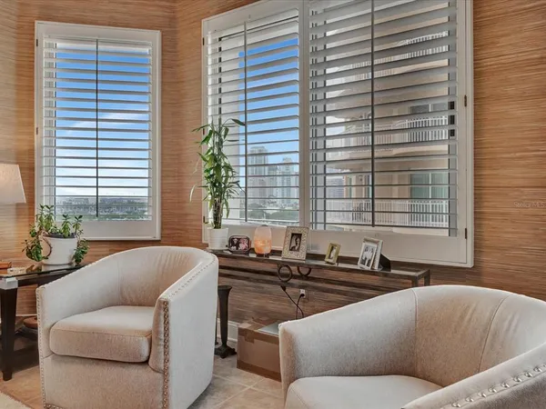 a living room with furniture and windows
