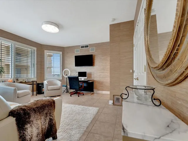 a view of a livingroom with workspace and a couch