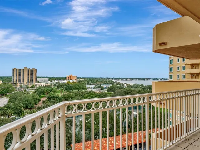 a view of a balcony with wooden fence