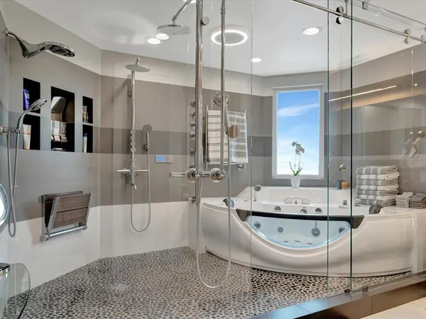 a bathroom with a granite countertop sink a mirror and shower