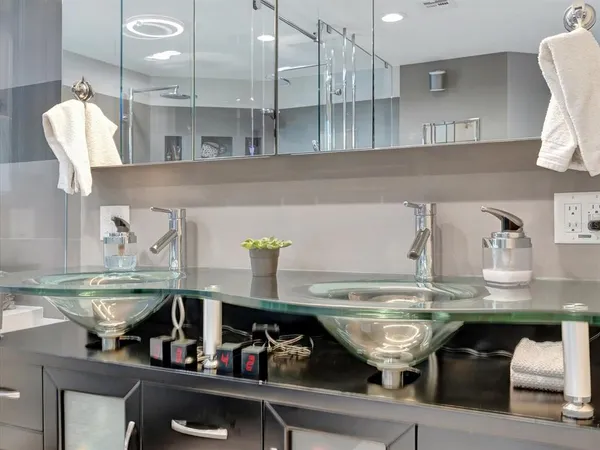 a kitchen with stainless steel appliances granite countertop a sink and white cabinets