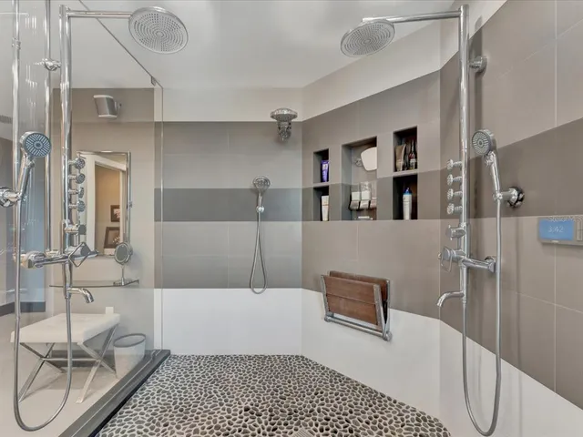 a bathroom with a bathtub and shower