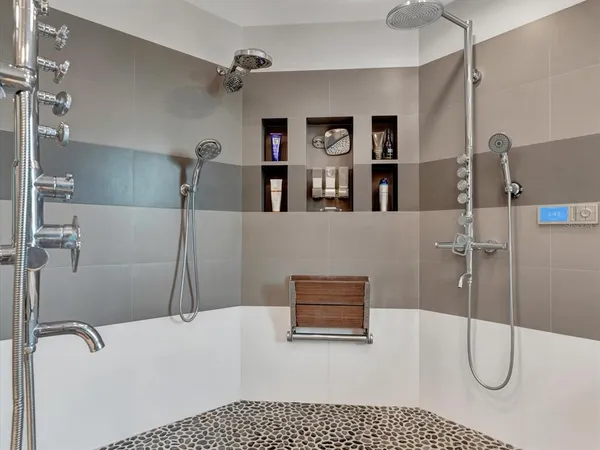 a bathroom with a bathtub and shower