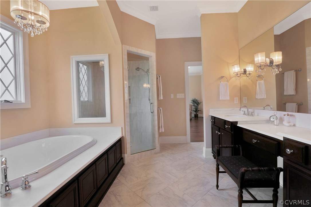 13430 Stonegate Road Midlothian, VA 23113 - Photo 20 of 35 a spacious bathroom with a tub sink and a mirror